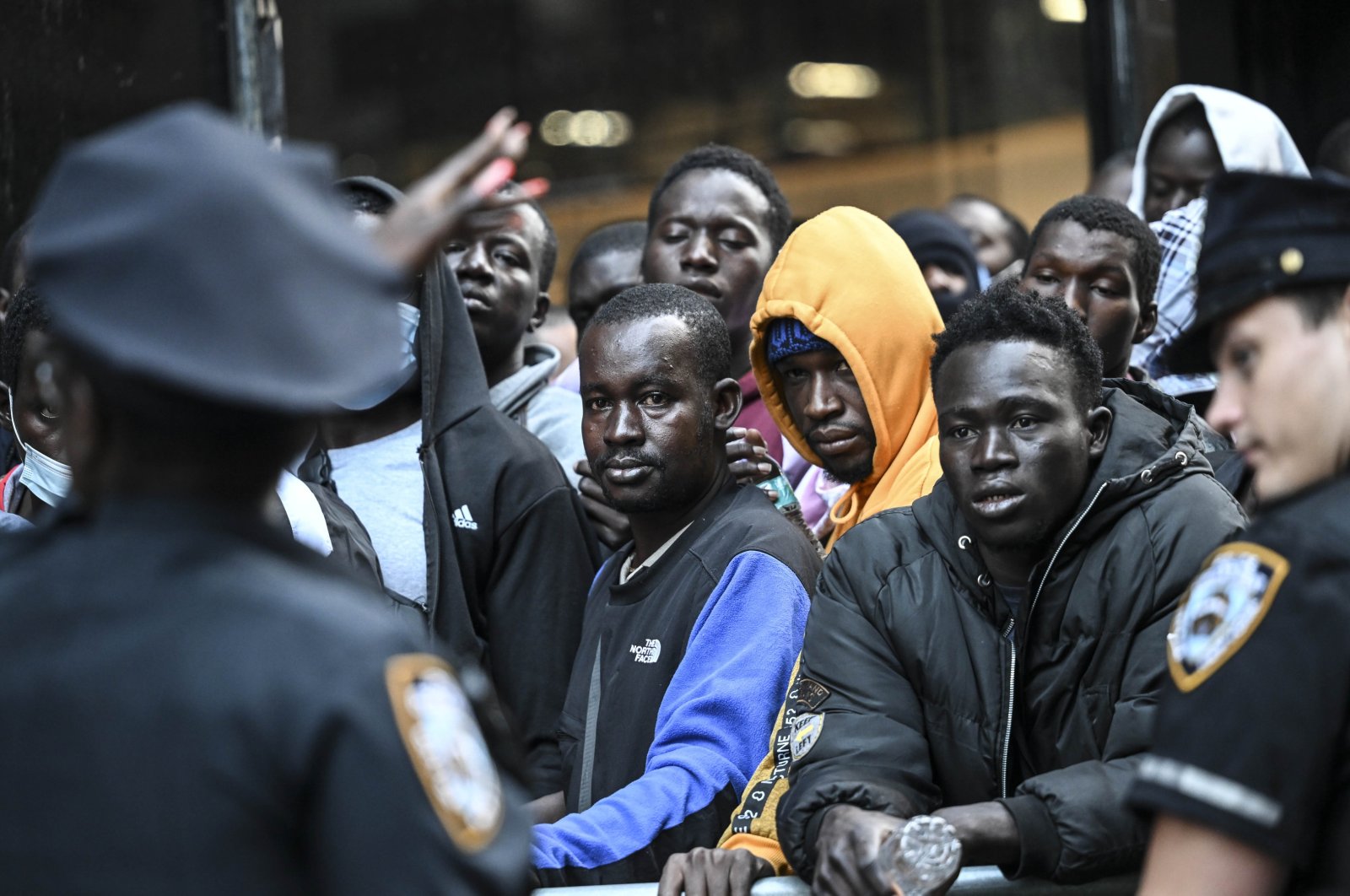 Migrants wait outside of the former Roosevelt Hotel in New York, New York, U.S., Aug. 2, 2023. (AA Photo)