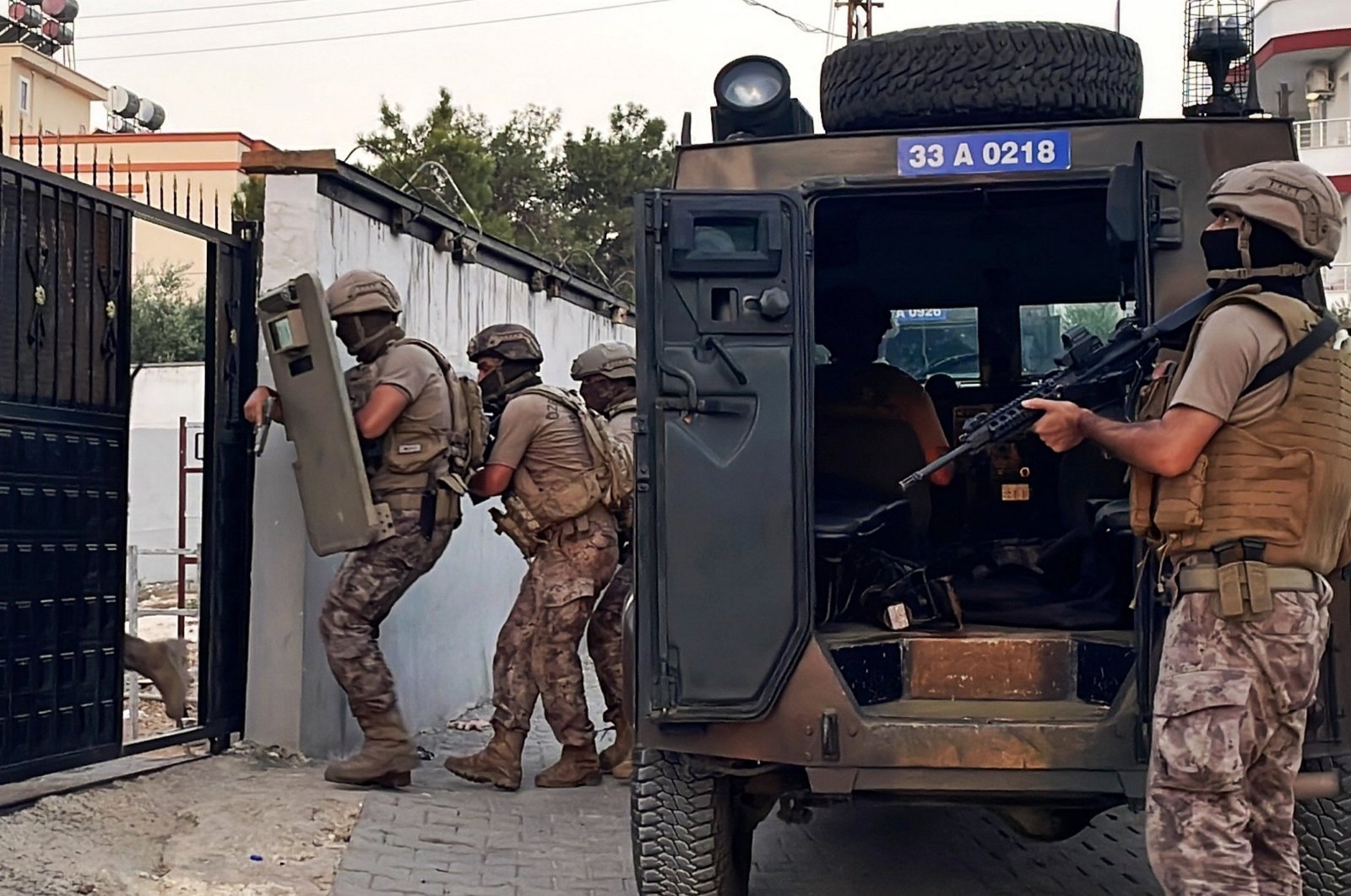 Security forces raid a location as part of an operation against financiers of the PKK terrorist group, Mersin, southern Türkiye, July 31, 2023. (AA Photo)