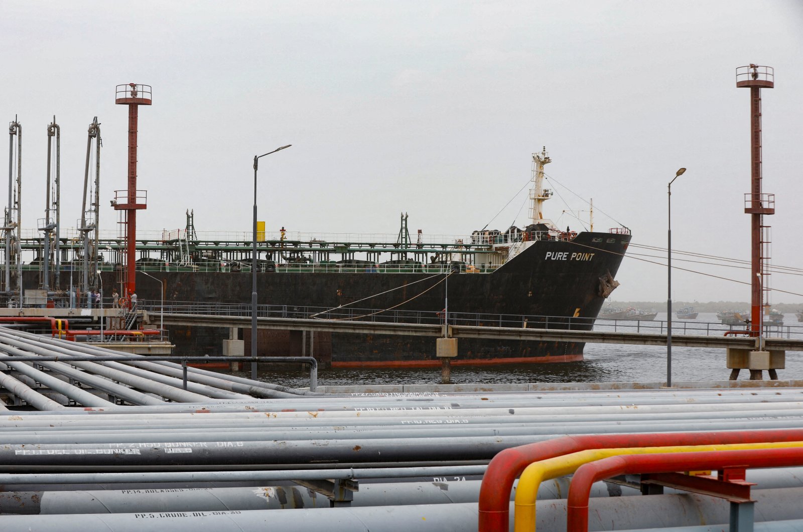 Crew members check the deck of the Russian oil cargo Pure Point, carrying crude oil, anchored at a port in Karachi, Pakistan, June 13, 2023. (Reuters Photo)