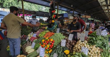 People buy vegetables, rations, and other essentials for their daily living at a local market in Colombo, Sri Lanka, July 17, 2023. (EPA Photo)