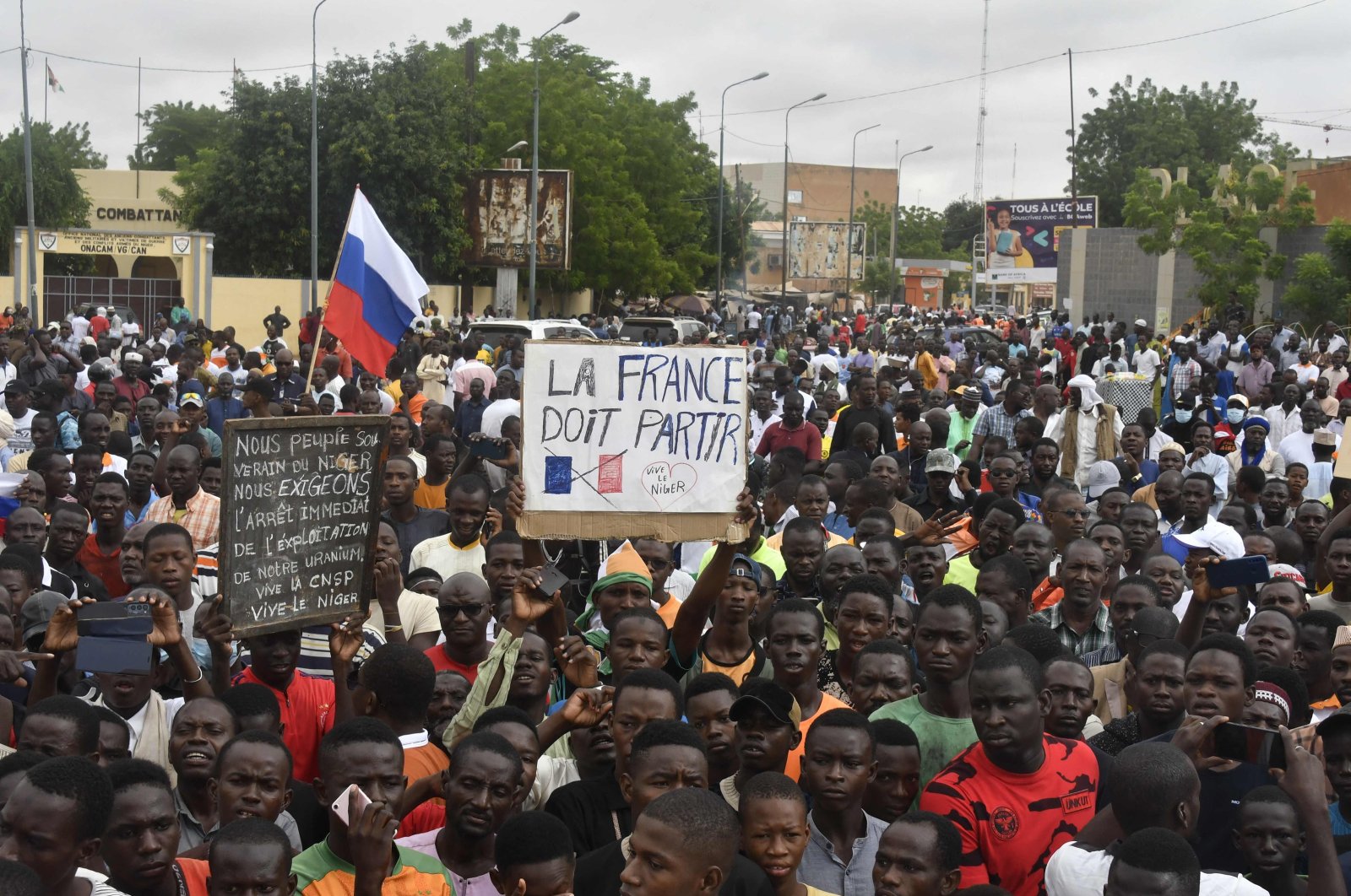 Protesters hold an anti-France placard during a demonstration on independence day in Niamey. Niger, Aug. 3, 2023. (AFP Photo)