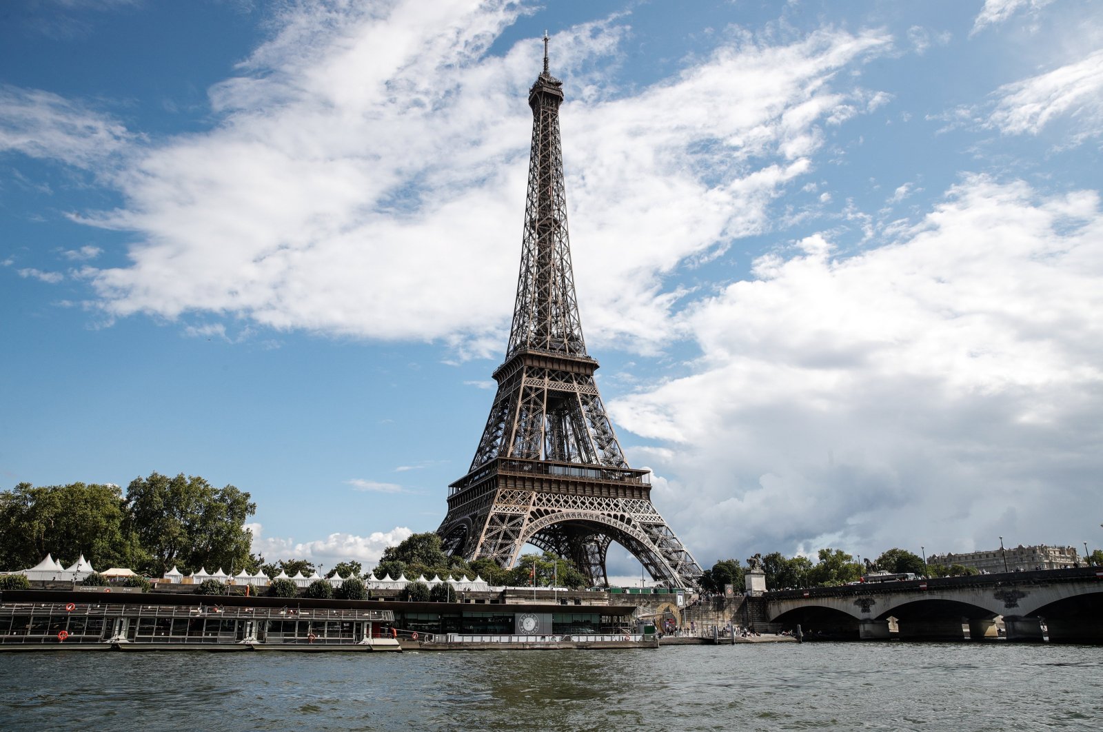 The Eiffel Tower next to the Seine River as it passes through Paris, France, Aug. 04, 2023.