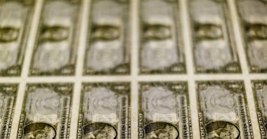 U.S. dollar bills are seen on a light table at the Bureau of Engraving and Printing in Washington, Nov. 14, 2014. (Reuters File Photo)