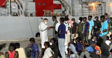 Around 700 migrants wait to board an Italian Navy ship to be taken to Messina and Calabria, Lampedua, Italy, July 18, 2023. (EPA Photo)