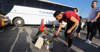 Mourners lay roses at the site where three Palestinians were killed by Israeli forces, Jenin, occupied West Bank, Palestine, Aug. 6, 2023. (AFP Photo)