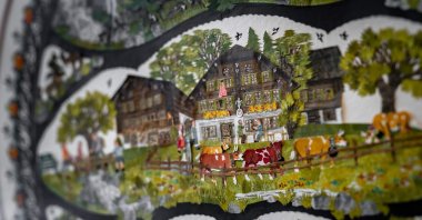 The photograph shows a detail of a work by Swiss paper cutting artist Marianne Dubuis at the Swiss Centre of Paper Cut in Chateau d&#039;Oex, the Prealps in western Switzerland, July 25, 2023. (AFP Photo)