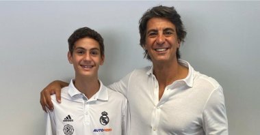 Former Turkish basketball star Ibrahim Kutluay (R) poses for a photo with his new Real Madrid star son Ömer Kutluay, Istanbul, Türkiye, Aug. 7, 2023. (IHA Photo)