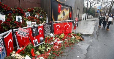 Flowers and pictures of the victims are placed near the entrance of Reina nightclub, attacked by a Daesh lone wolf terrorist, in Istanbul, Türkiye, Jan. 17, 2017. (Reuters Photo)