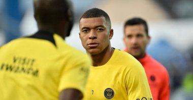Paris Saint-Germain&#039;s French forward Kylian Mbappe looks on as he warms up before the French L1 football match between AJ Auxerre and PSG at Stade de l&#039;Abbe-Deschamps, Auxerre, France, May 21, 2023. (AFP Photo)