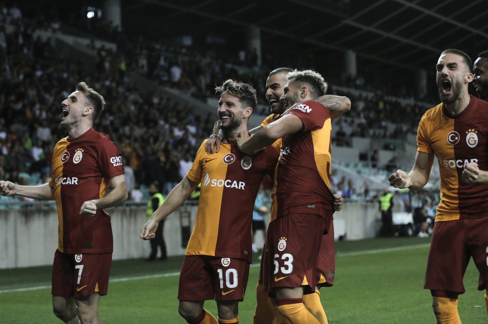 Galatasaray players celebrate after scoring against Olimpija Ljubljana during the UEFA Champions League qualifiers 3rd round match, Ljubljana, Slovenia, Aug. 8, 2023. (AA Photo)