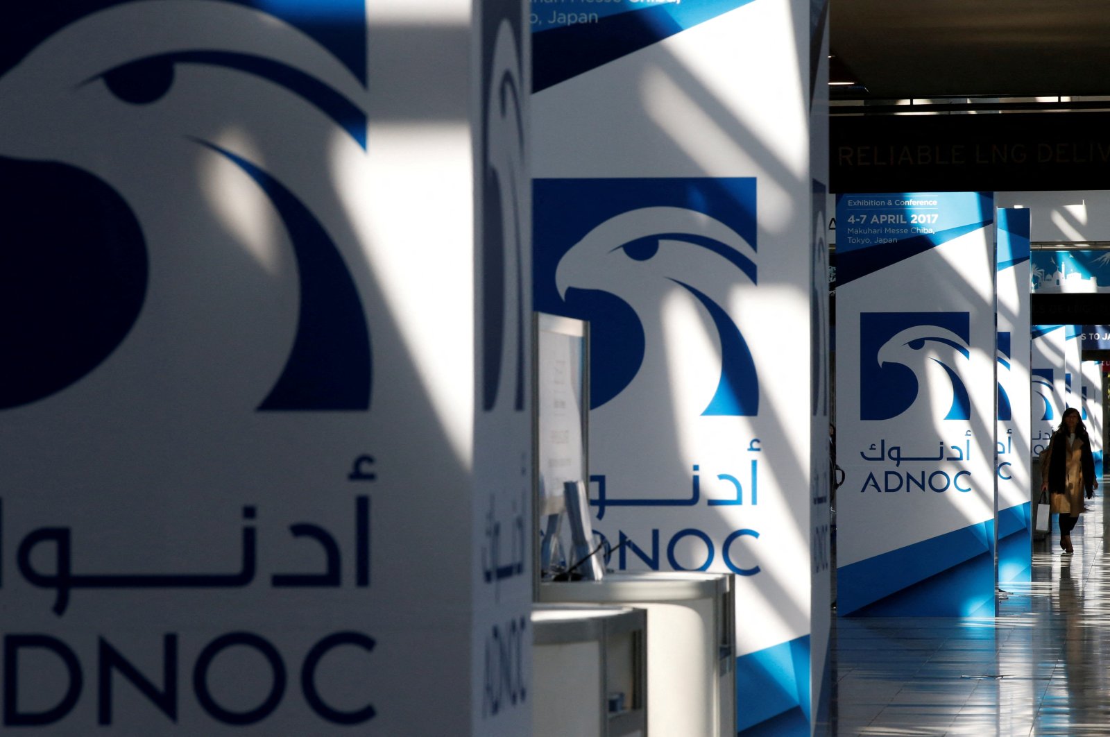 Logos of ADNOC at Gastech, the world&#039;s biggest expo for the gas industry, in Chiba, Japan, April 4, 2017. (Reuters Photo)