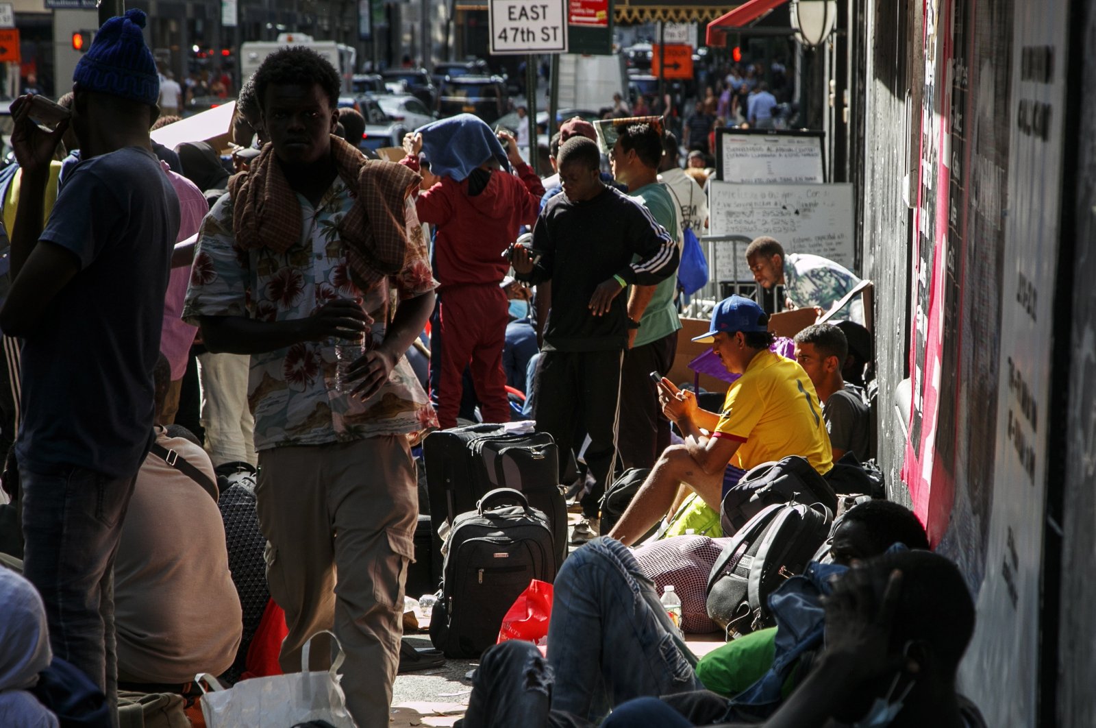 Migrants wait outside of the former Roosevelt Hotel in New York, New York, Aug. 1, 2023. (EPA Photo)