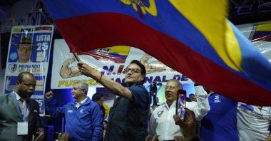 Presidential candidate Fernando Villavicencio waves an Ecuador national flag during a campaign event in Quito, Ecuador, Aug. 9, 2023 (AP Photo)