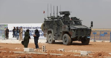 A Turkish military vehicle is seen during the inauguration of a Turkish-funded housing complex for the internally displaced, in Ghandoura, in the countryside of Jarablus district near the Turkish border, northern Syria, May 24, 2023. (AFP Photo)