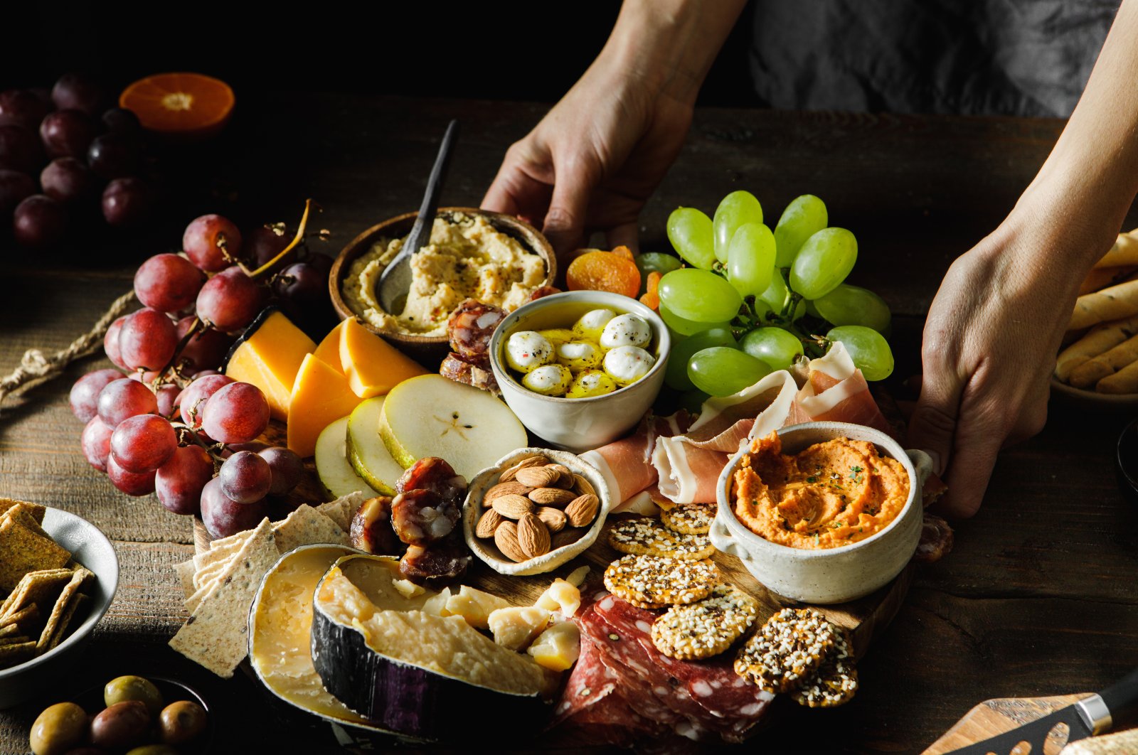 A cheese and meat platter with fruits. (Getty Images Photo)