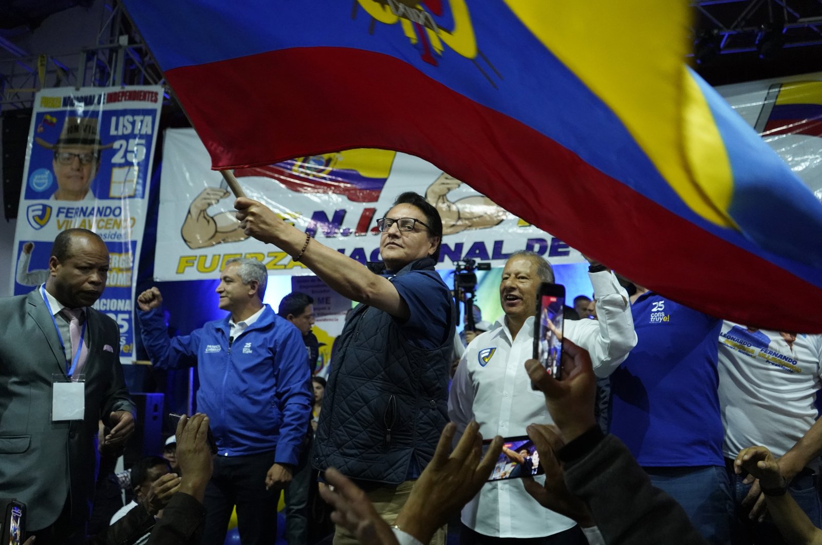 Presidential candidate Fernando Villavicencio waves an Ecuador national flag during a campaign event in Quito, Ecuador, Aug. 9, 2023 (AP Photo)