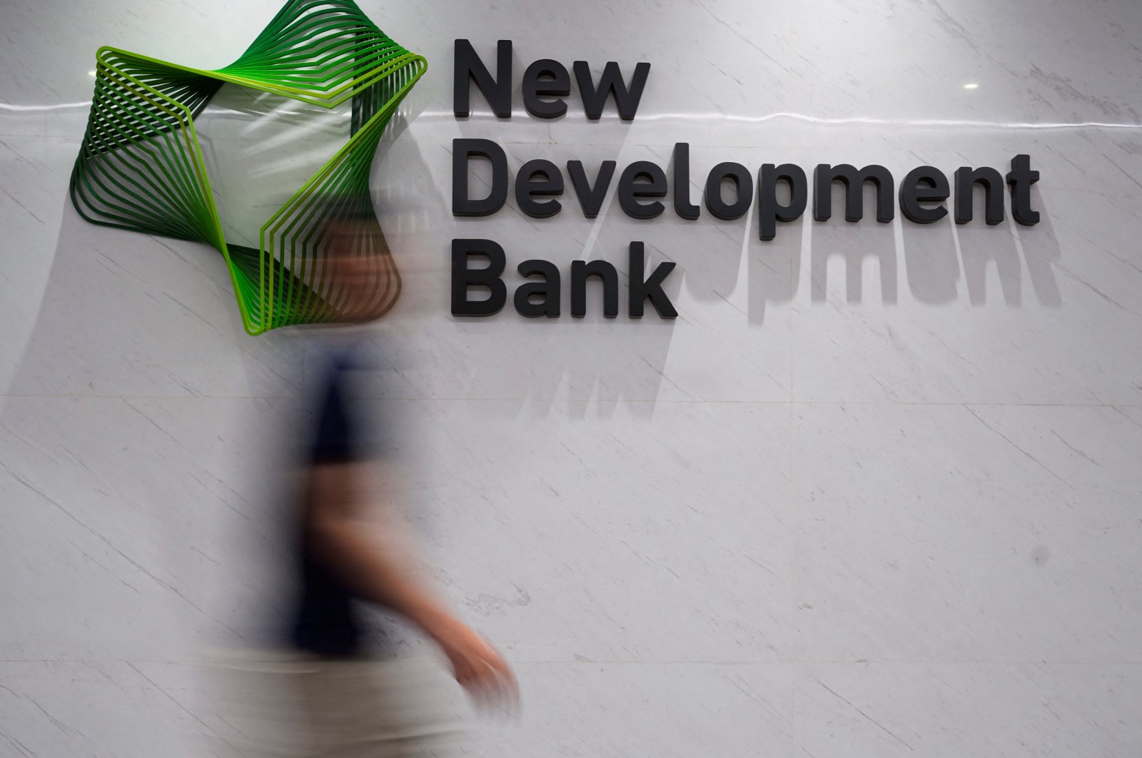 A view of the logo of the New Development Bank (NDB) at its headquarters in Shanghai, China, July 10, 2023. (Reuters Photo)