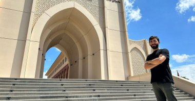 Yılmaz Acar poses in front of Ibn Haldun University, Istanbul, Türkiye, Aug. 11, 2023. (Courtesy of Ibn Haldun University)
