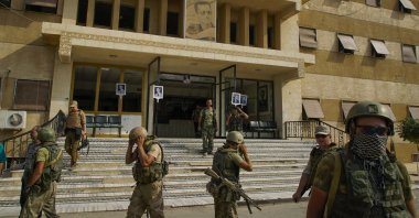 Russian military police soldiers walk outside a hospital in Deir el-Zour, Syria, Sept. 15, 2017. (AP File Photo)