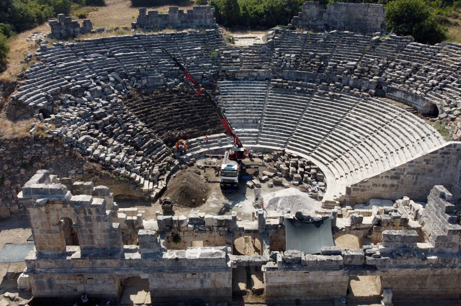 An aerial view shows the restoration works in Tlos&#039; ancient theater, in the Seydikemer district, Muğla, southwestern Türkiye, Aug. 11, 2023. (AA Photo)