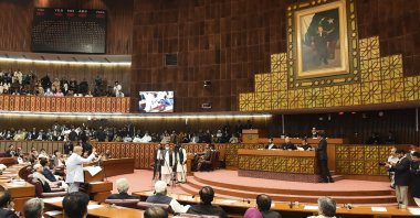 In this photo released by the National Assembly of Pakistan, newly elected Pakistani Prime Minister Shahbaz Sharif, lower left, addresses during a session of the National Assembly, in Islamabad, Pakistan, Monday, April 11, 2022. (National Assembly of Pakistan via AP)