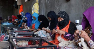 Afghan women spin wool into yarn at a traditional factory in the Herat province of Jibrail district, Afghanistan, Aug. 7, 2023. (AFP Photo)