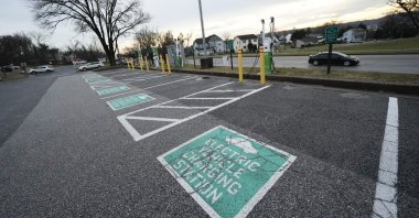 Chargers are seen near parking stalls dedicated for electric vehicles outside of the Cockeysville Public Library in Cockeysville, Maryland, U.S., Jan. 3, 2023. (AP Photo)