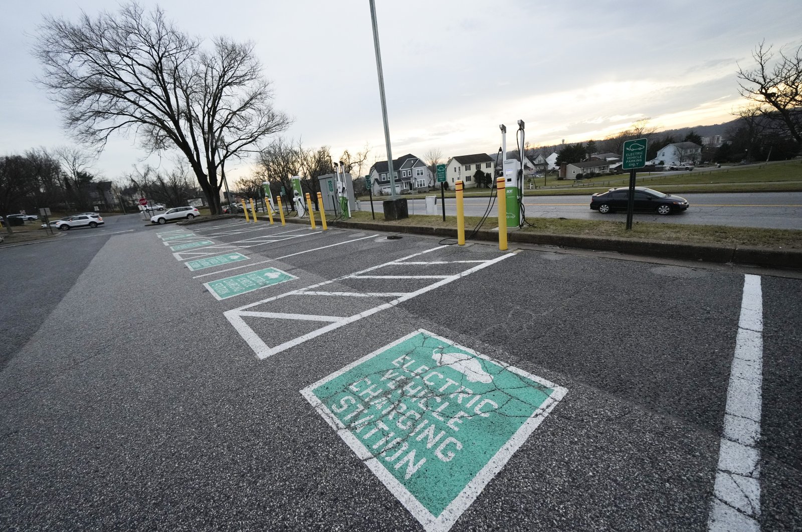 Chargers are seen near parking stalls dedicated for electric vehicles outside of the Cockeysville Public Library in Cockeysville, Maryland, U.S., Jan. 3, 2023. (AP Photo)