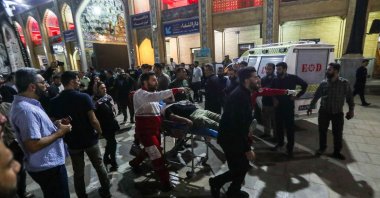 An injured person is carried away on a stretcher following a shooting at the Shah Cheragh shrine in Shiraz, Iran, Aug. 13, 2023. (EPA Photo)