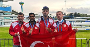 Turkish rowers pose with the flag and their medals after winning at the Under-23 World Rowing Championships, Plovdiv, Bulgaria, Aug. 6, 2023. (IHA Photo)