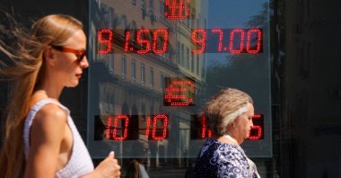 A board showing currency exchange rates of the U.S. dollar and euro against the Russian ruble is on display in a street in Moscow, Russia, Aug. 7, 2023. (Reuters Photo)