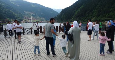 Local and foreign tourists are seen at Uzungöl, a famed lake situated to the south of the city of Trabzon, northern Türkiye, Aug. 14, 2023. (IHA Photo)