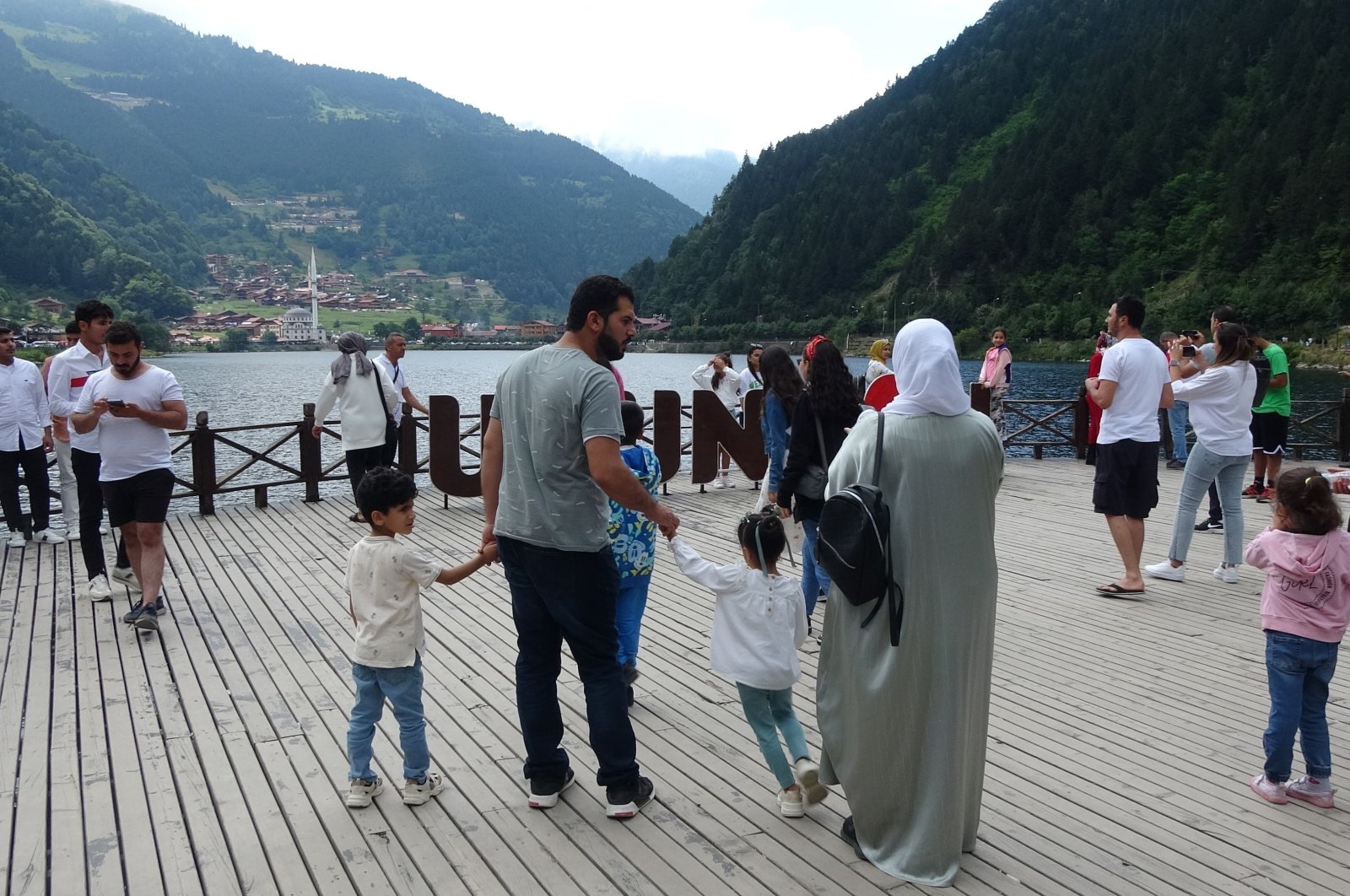 Local and foreign tourists are seen at Uzungöl, a famed lake situated to the south of the city of Trabzon, northern Türkiye, Aug. 14, 2023. (IHA Photo)