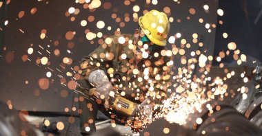 A worker welds metal at a factory in Hangzhou in China's eastern Zhejiang province, July 15, 2023. (AFP Photo)