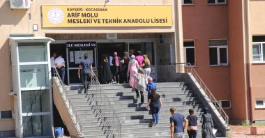 People enter a school to sit the KPSS exam, in Kayseri, central Türkiye, July 31, 2022. (AA Photo)