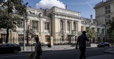People walk past the Bank of Russia headquarters in Moscow, Russia, Aug. 1, 2023. (EPA Photo)