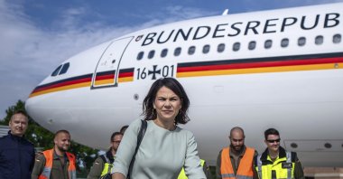 Germany's Foreign Minister Annalena Baerbock walks through the airport of the airbase after her arrival from New York, in Bonn, Germany, July 18, 2023. (AP Photo)