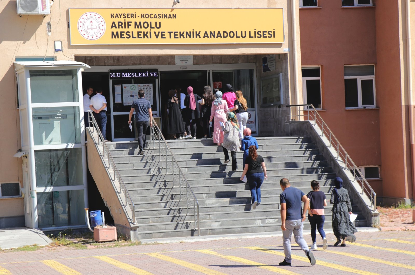 People enter a school to sit the KPSS exam, in Kayseri, central Türkiye, July 31, 2022. (AA Photo)