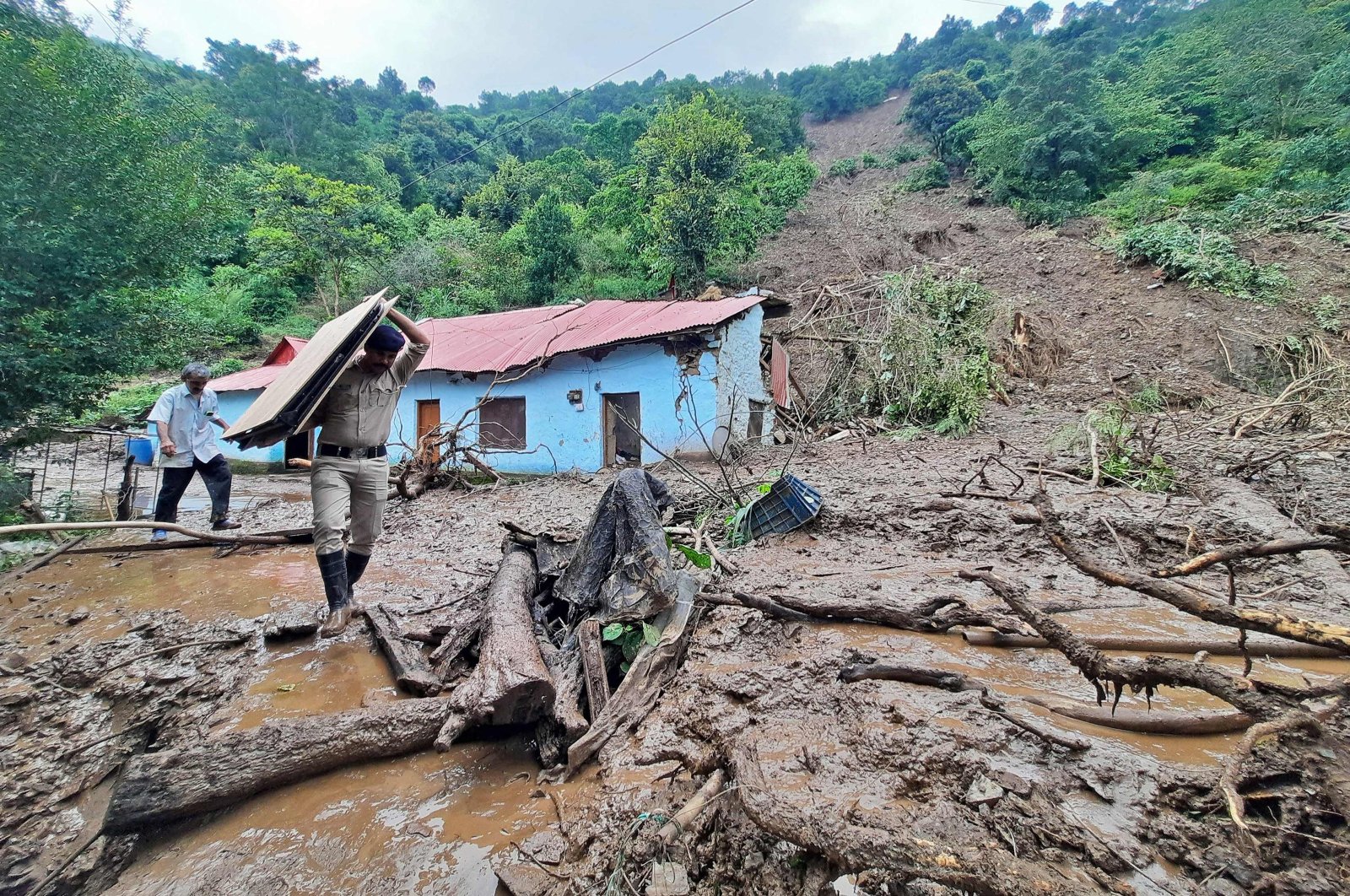 Security personnel at the site of a landslide at Jadon village in Solan district, Himachal Pradesh, India, Aug. 14, 2023. (AFP Photo)