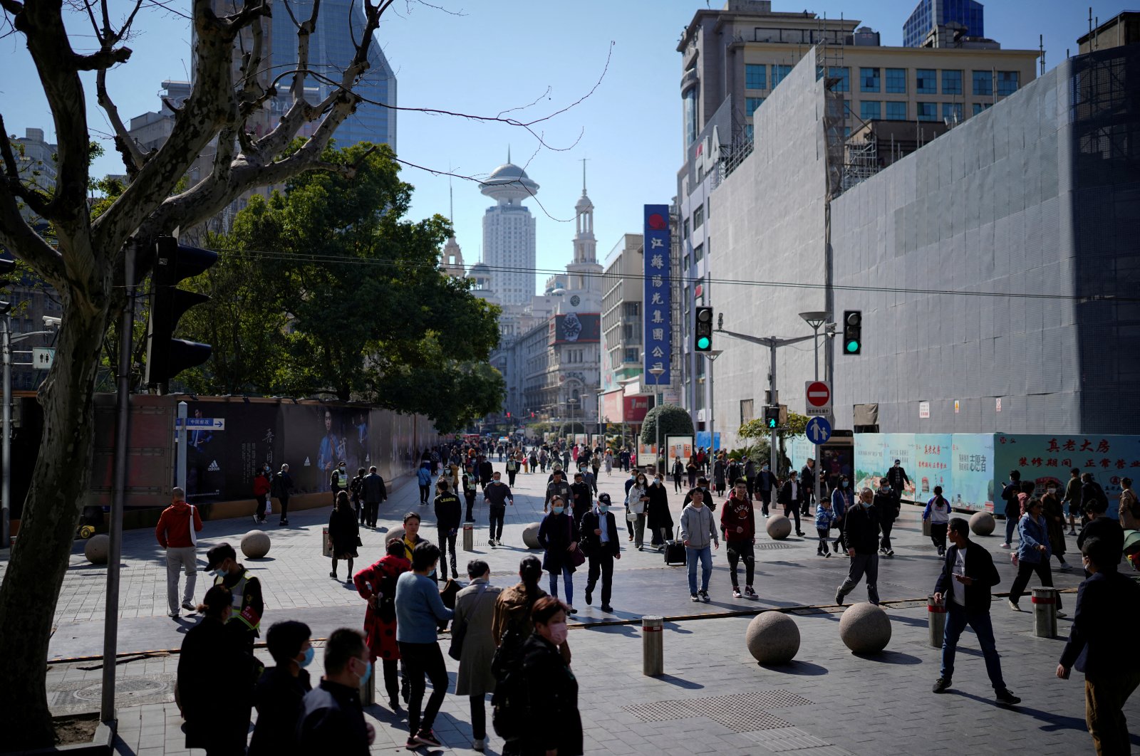 People walk at the main shopping area in Shanghai, China, March 14, 2023. (Reuters Photo)