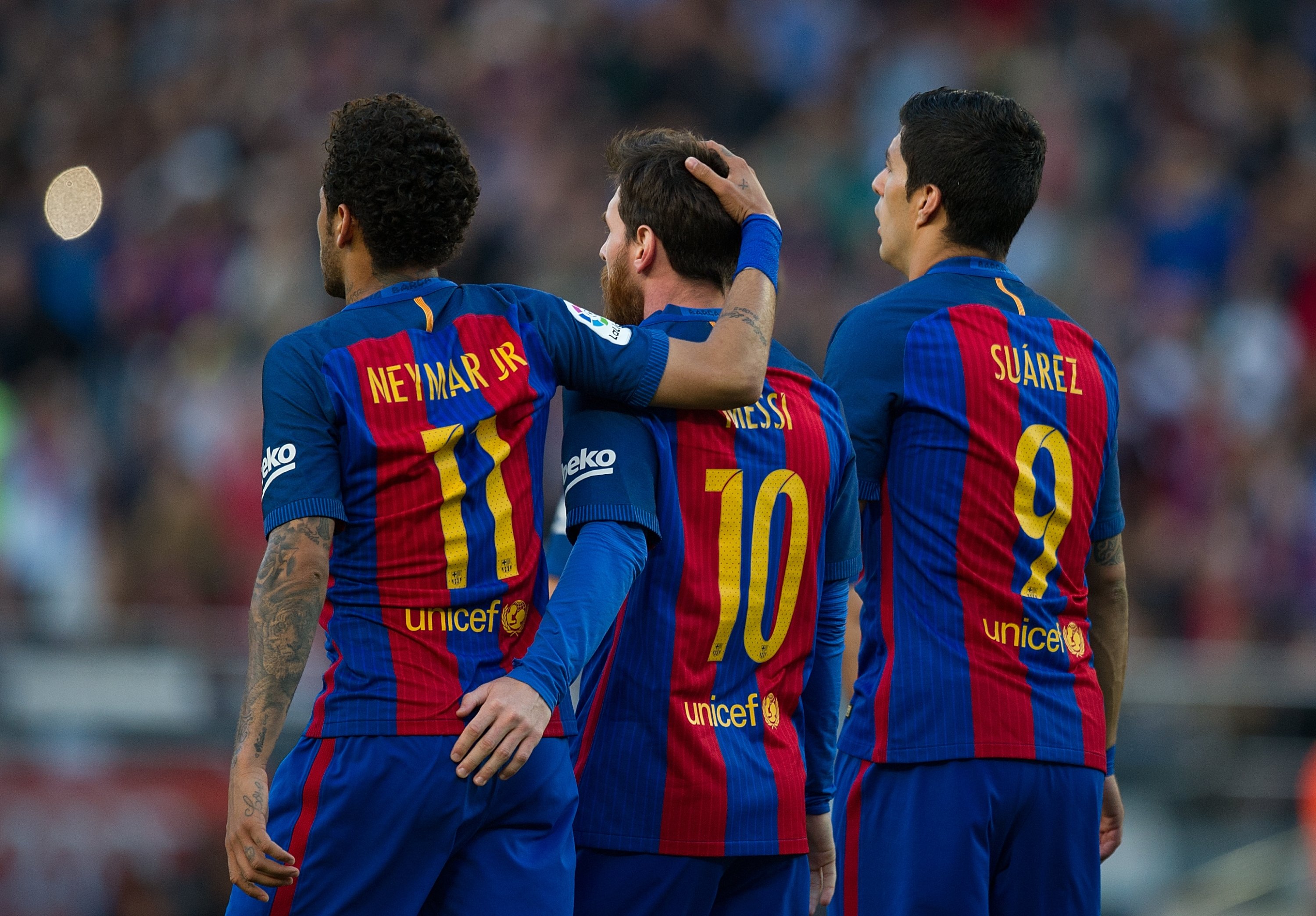 FC Barcelona's Lionel Messi (C) celebrates with Neymar (L) and Luis Suarez after scoring his team's third goal from the penalty spot during the La Liga match between FC Barcelona and Villarreal CF at Camp Nou stadium, Barcelona, Spain, May 6, 2017.  (Getty Images Photo)