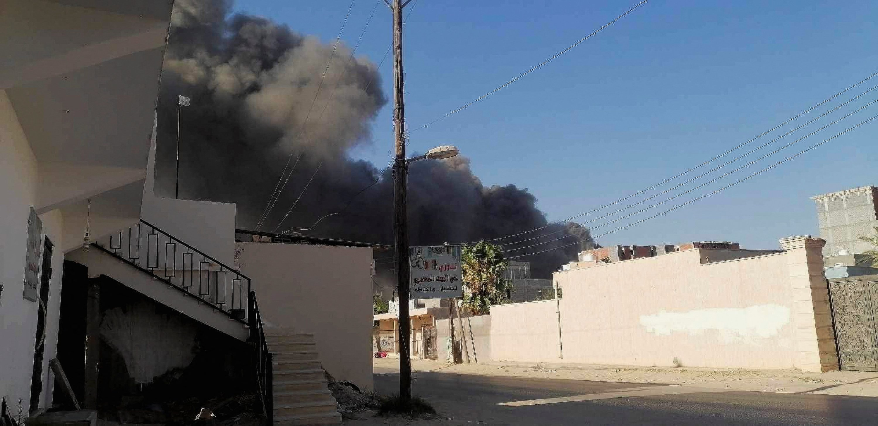 Smoke rises amid clashes between armed factions, in Tripoli, Libya, Aug. 15, 2023. (Reuters Photo)