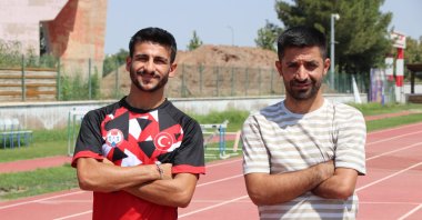 Şırnak's athlete Mikail Al (R) poses for a photo after training for the 2024 Paris Paralympic Games, Şırnak, Türkiye, Aug. 11, 2023. (AA Photo)