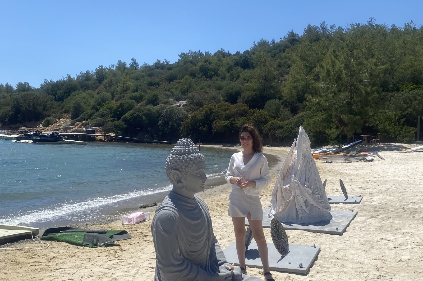 The artist Ceysu Uçan poses with her artwork in her &quot;Cocoon&quot; exhibition, Bodrum, Muğla, Türkiye. (Photo courtesy of the artist)