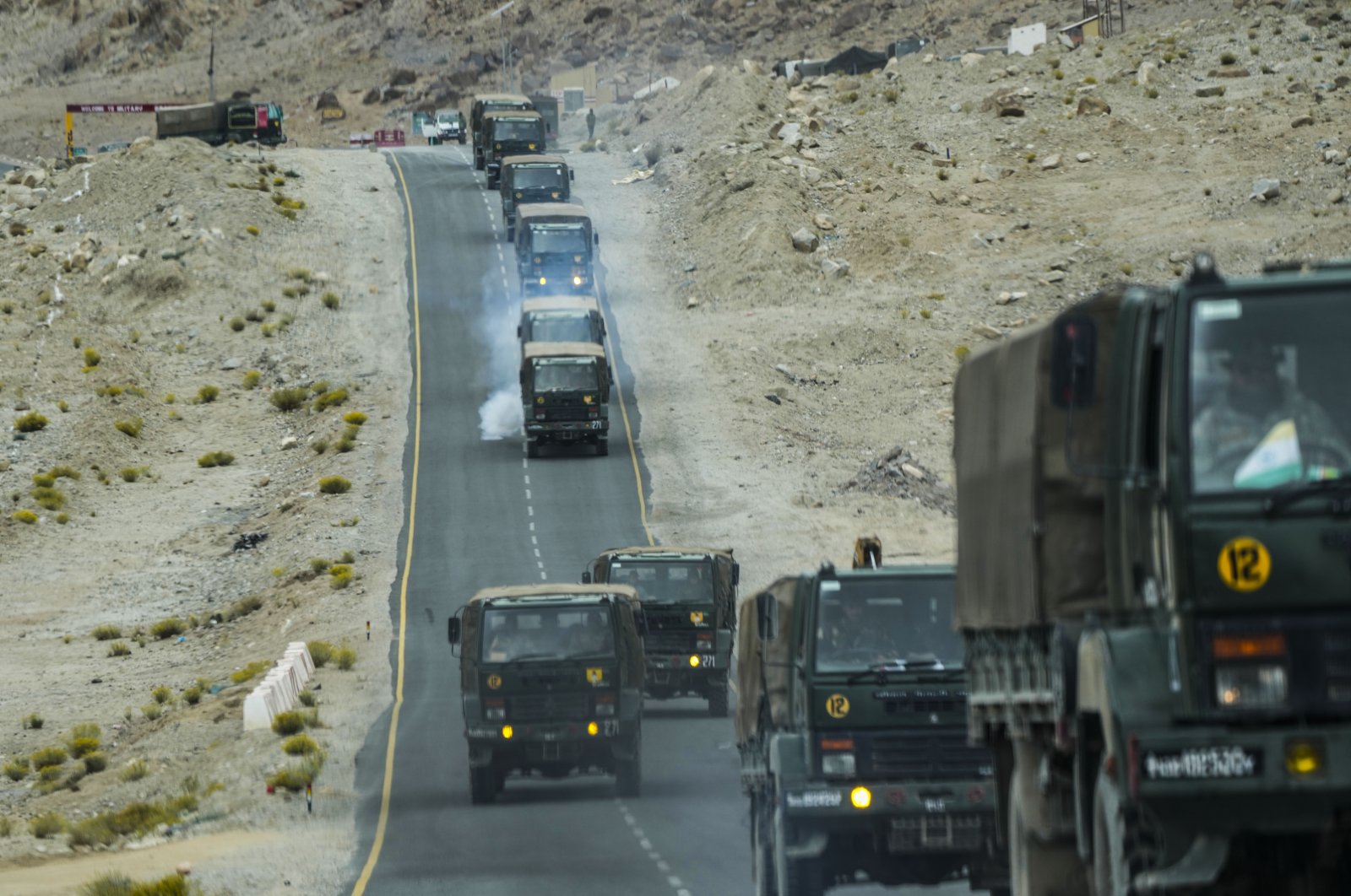Indian army vehicles move in a convoy in Ladakh, India, Sept. 20, 2022. (AP Photo)