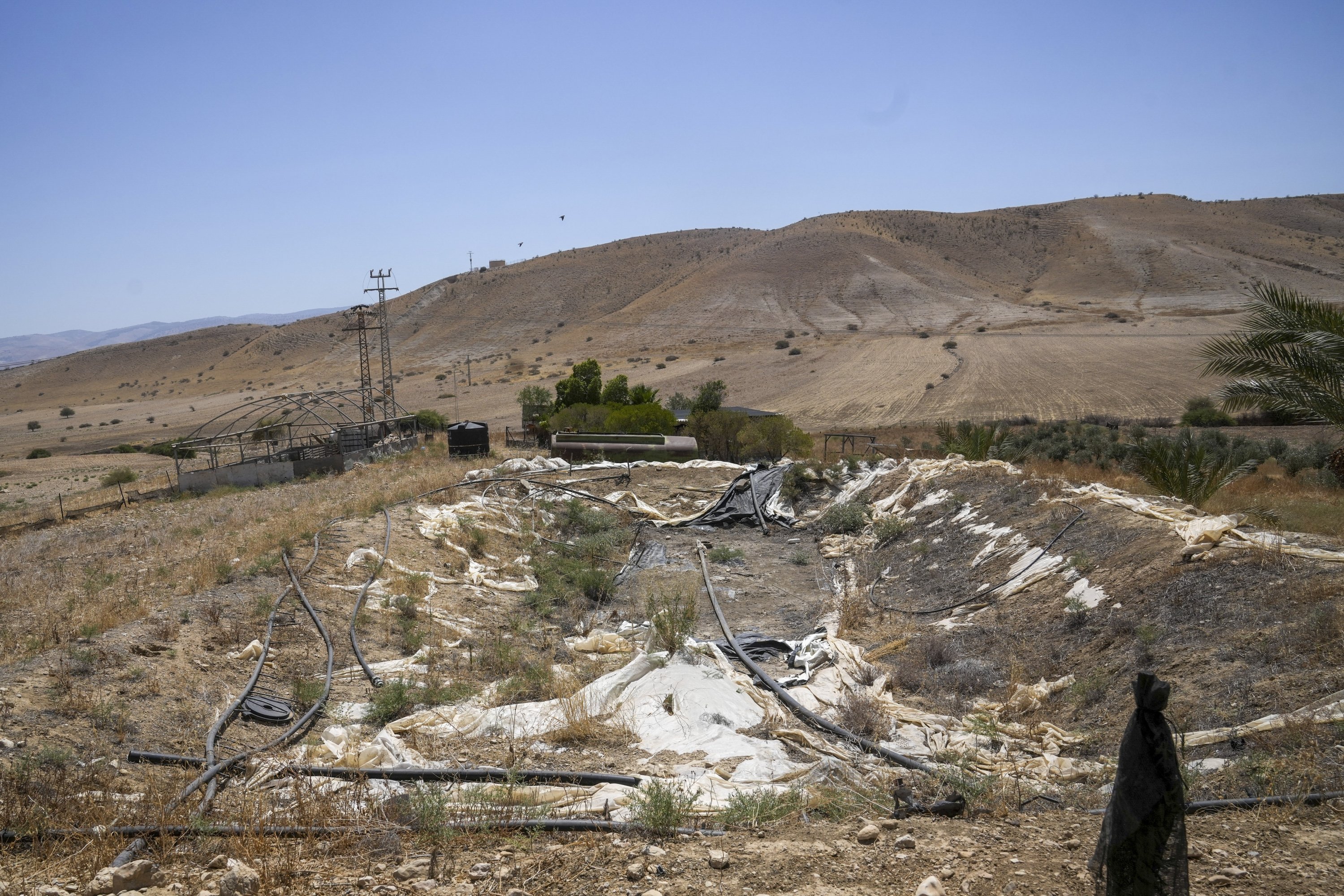 A dried water basin is seen near the Palestinian village of Bardala in the Jordan Valley, occupied West Bank, Aug. 7, 2023. (AP Photo)