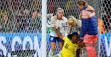 Nigeria goalkeeper Chiamaka Nnadozie of Nigeria is consoled by England players after the Women's World Cup Round of 16 match at Brisbane Stadium, Brisbane, Australia, Aug. 07, 2023. (Getty Images Photo)