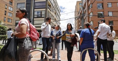 People stand on a street as they are evacuated from buildings after an earthquake shakes Bogota, Colombia, Aug. 17, 2023. (EPA Photo)