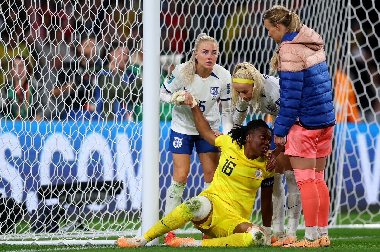 Nigeria goalkeeper Chiamaka Nnadozie of Nigeria is consoled by England players after the Women&#039;s World Cup Round of 16 match at Brisbane Stadium, Brisbane, Australia, Aug. 07, 2023. (Getty Images Photo)