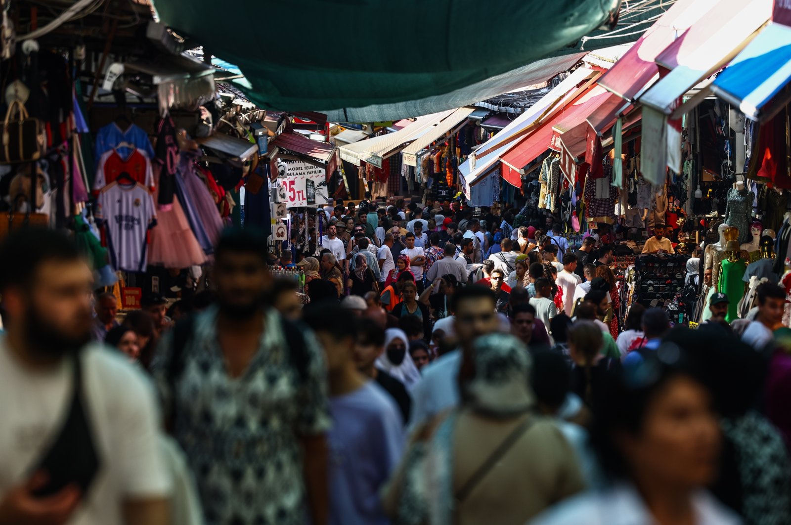 People walk through the old city bazaar in Istanbul, Türkiye, July 19, 2023. (EPA Photo)